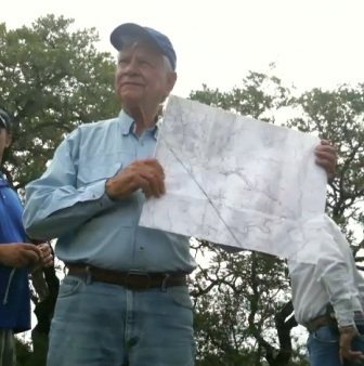 Man holding up a map.